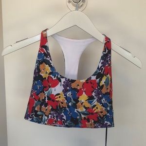BeachRiot classic racerback sports bra in a multi colored floral print
